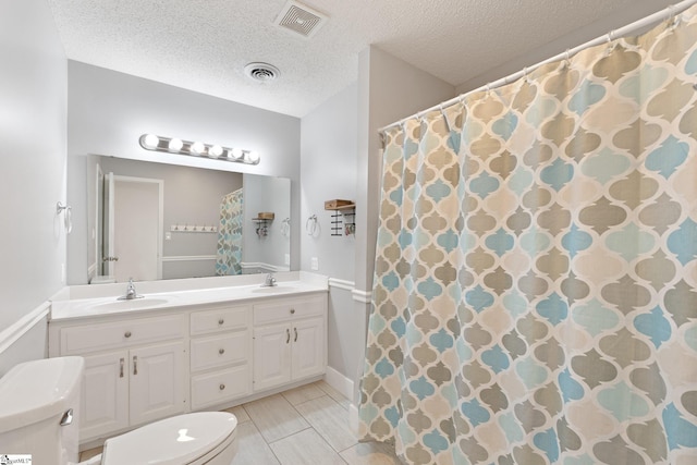 full bathroom featuring double vanity, a sink, and visible vents