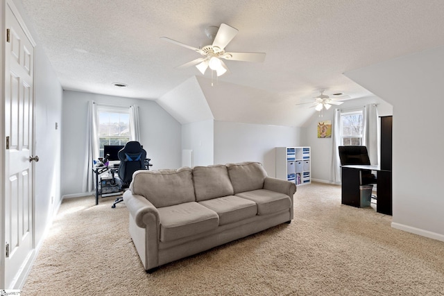 living area featuring lofted ceiling, a textured ceiling, and light colored carpet