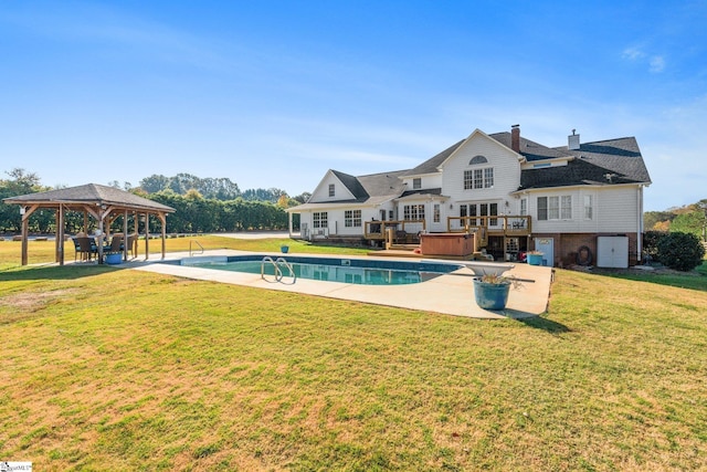 view of pool featuring a hot tub, central AC unit, a lawn, a gazebo, and a patio area