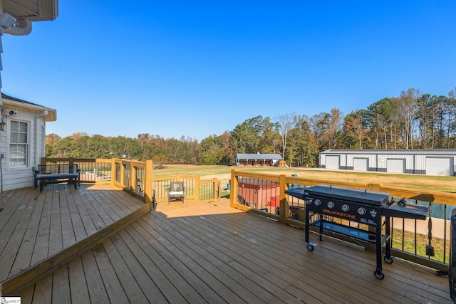 wooden terrace featuring an outbuilding