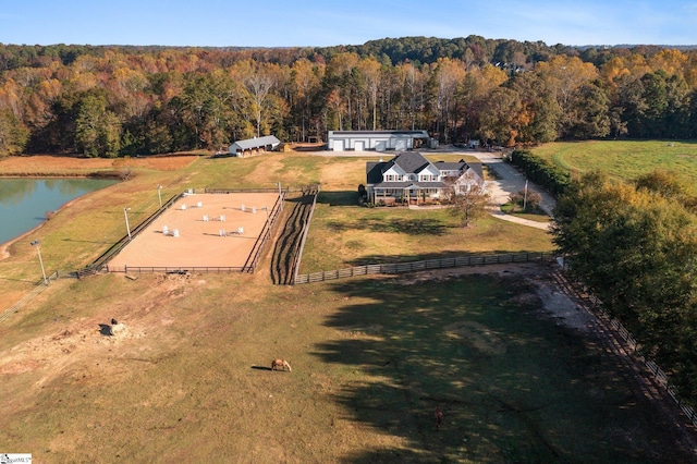 aerial view with a water view and a forest view