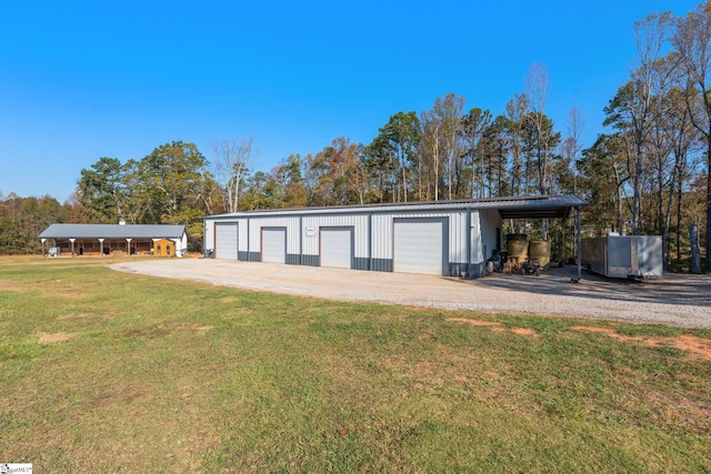 garage with a detached garage and driveway