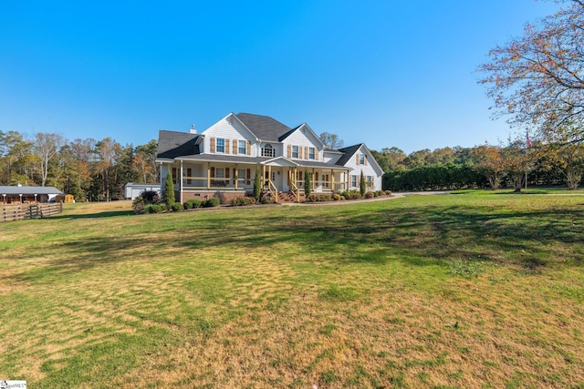 view of front of house featuring a porch and a front yard