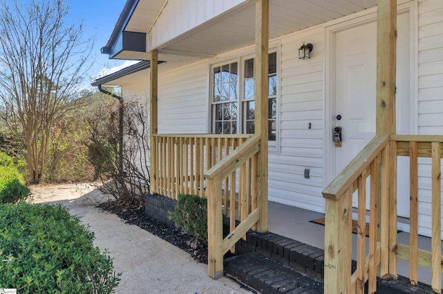 view of exterior entry with covered porch