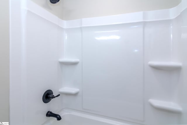 bathroom with shower / bath combination