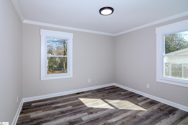 unfurnished room with dark wood-type flooring, plenty of natural light, and baseboards