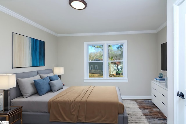 bedroom featuring ornamental molding, dark wood-style flooring, and baseboards