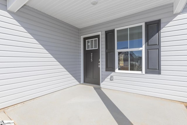 entrance to property with a patio