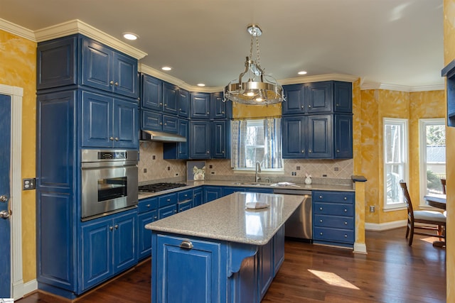 kitchen with blue cabinets, stainless steel appliances, a sink, a center island, and decorative light fixtures