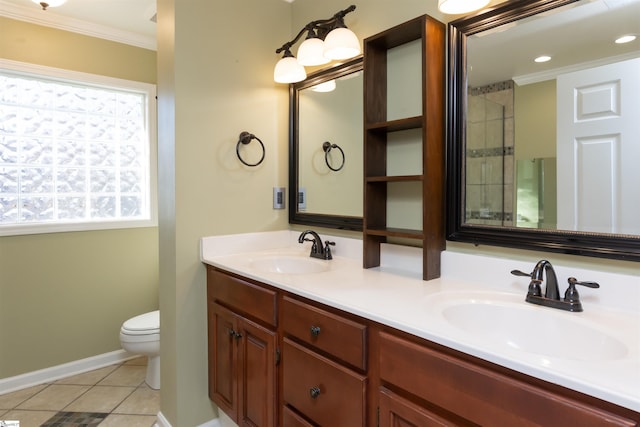 bathroom featuring double vanity, tile patterned flooring, a sink, and crown molding