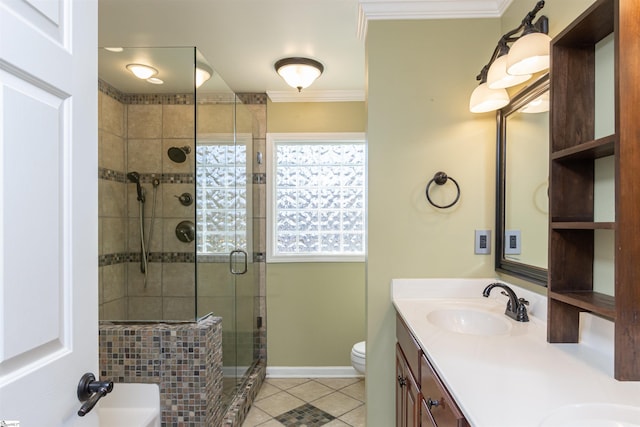 bathroom featuring toilet, ornamental molding, a sink, a shower stall, and tile patterned flooring