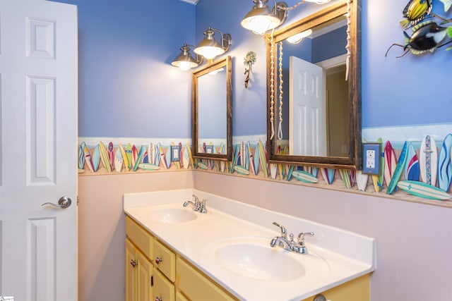 full bathroom featuring double vanity and a sink