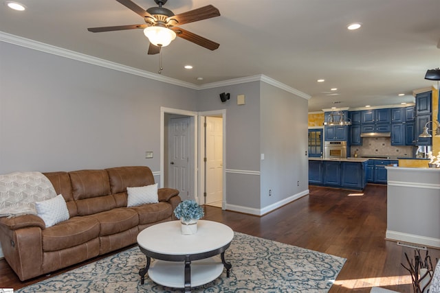 living room featuring baseboards, ornamental molding, dark wood-type flooring, and recessed lighting