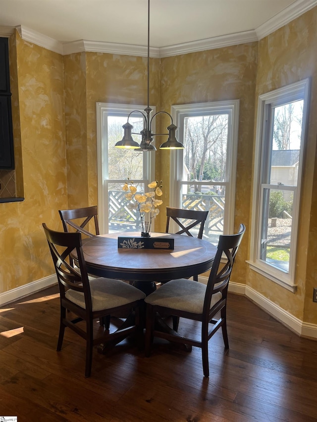 dining space featuring baseboards, a notable chandelier, dark wood finished floors, and crown molding