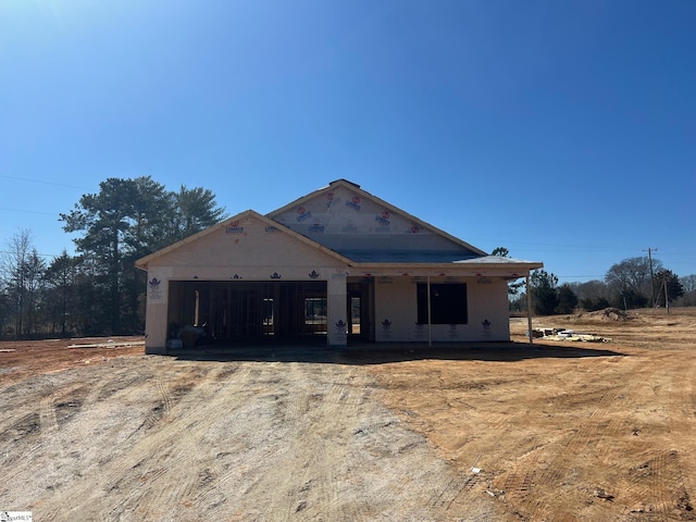 property in mid-construction with a garage and driveway