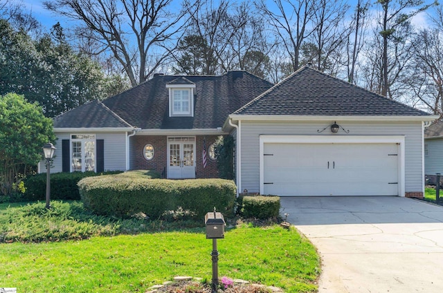 view of front of house featuring driveway, brick siding, a front lawn, and an attached garage