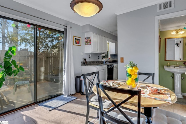 dining space featuring visible vents, crown molding, and light tile patterned floors