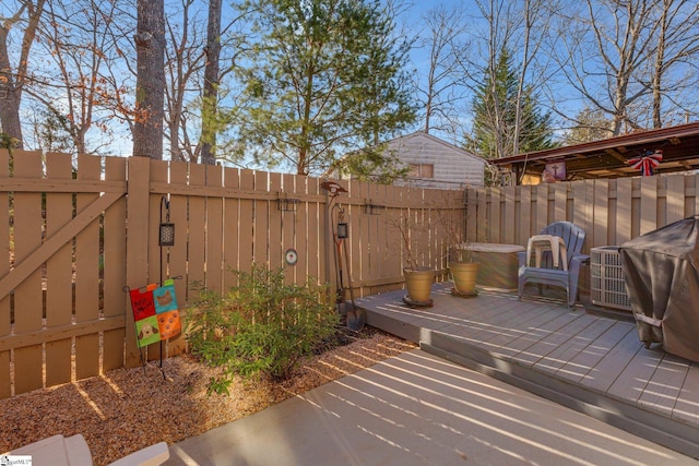 view of patio / terrace featuring a fenced backyard, a gate, and a deck