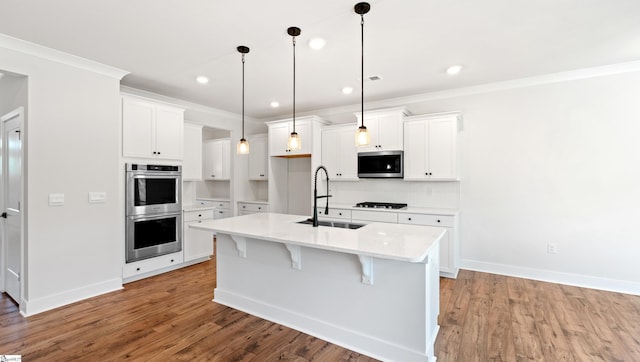 400 Fiery Rd Lot 0173, Mauldin, SC 29607 - kitchen with a sink, appliances with stainless steel finishes, light wood finished floors, white cabinetry, and crown molding
