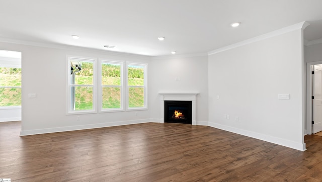 400 Fiery Rd Lot 0173, Mauldin, SC 29607 - unfurnished living room with crown molding, dark wood-style flooring, a warm lit fireplace, baseboards, and recessed lighting