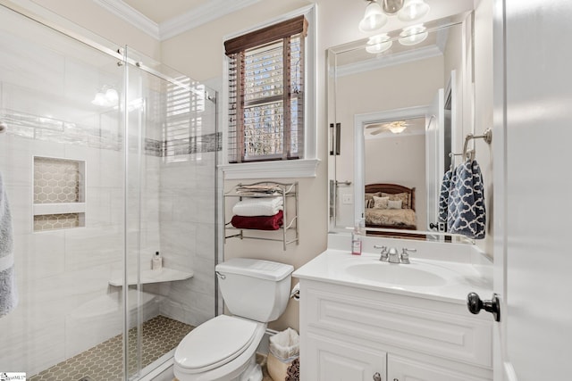 ensuite bathroom with toilet, vanity, a shower stall, ensuite bath, and crown molding