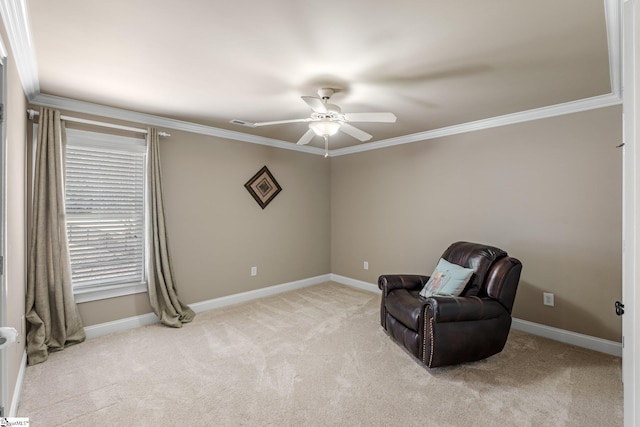 sitting room with light carpet, visible vents, baseboards, a ceiling fan, and crown molding