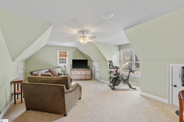 interior space with light carpet, baseboards, and a wealth of natural light