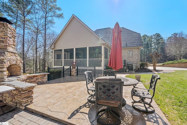 view of patio / terrace featuring a sunroom