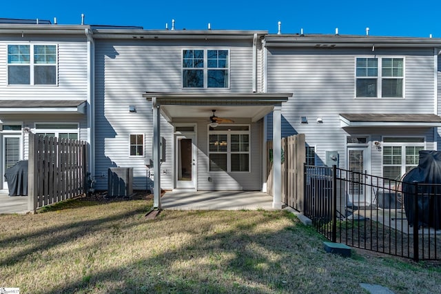 back of house featuring ceiling fan, central AC unit, fence, a yard, and a patio area