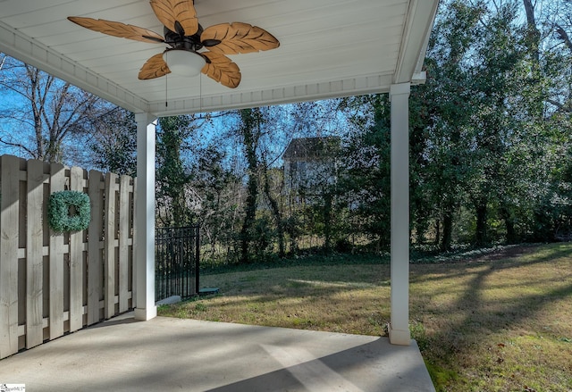 view of yard featuring ceiling fan, a patio, and fence