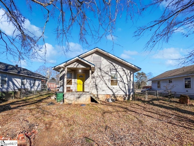 bungalow-style home with fence private yard