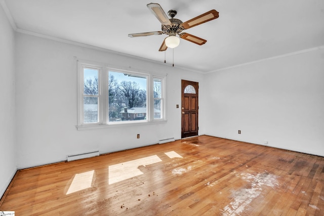 spare room with ornamental molding, a baseboard radiator, ceiling fan, and light wood-style flooring