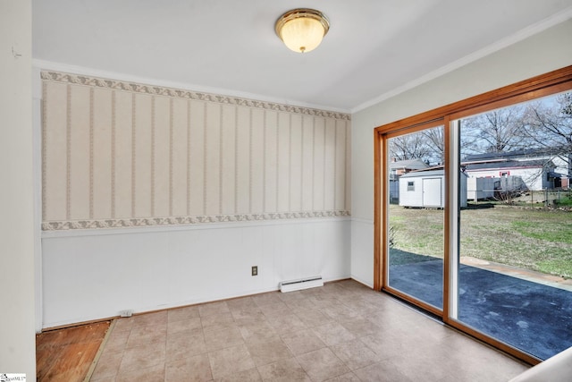 unfurnished room featuring a baseboard heating unit and ornamental molding