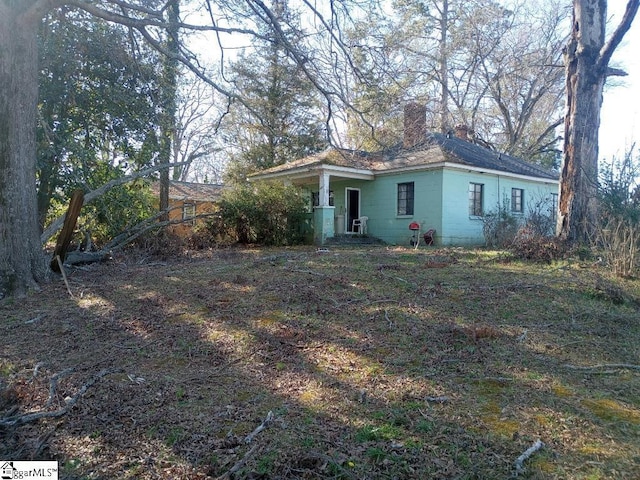 view of front of home with a chimney