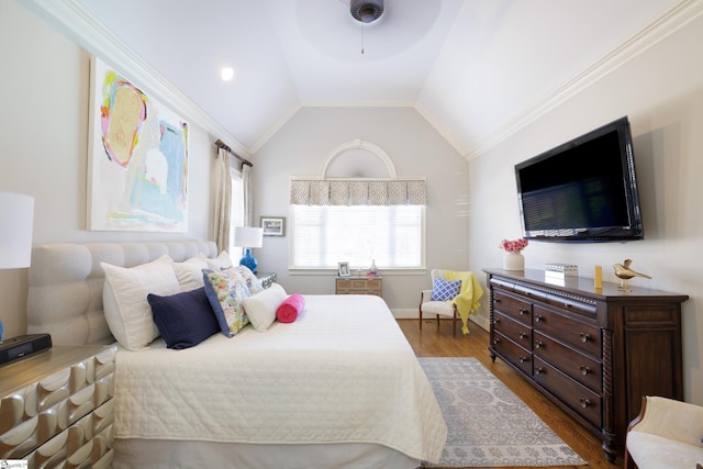 bedroom featuring crown molding, baseboards, vaulted ceiling, and dark wood-type flooring