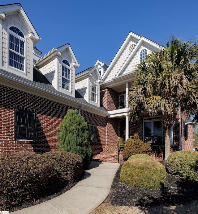 view of property exterior featuring brick siding