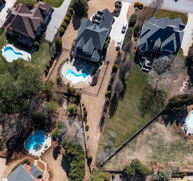 birds eye view of property with a residential view