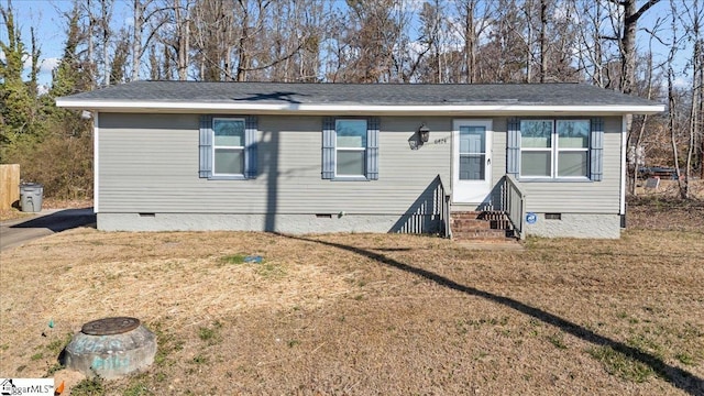 manufactured / mobile home featuring entry steps, a front lawn, and crawl space