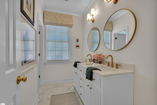 bathroom with ornamental molding, marble finish floor, a sink, and baseboards