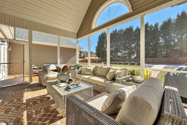 sunroom / solarium with lofted ceiling