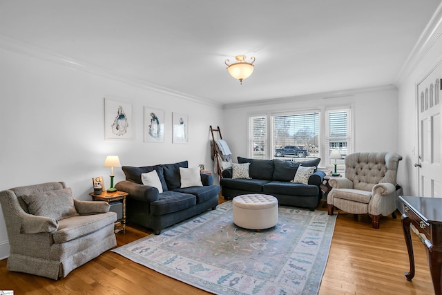 living room featuring ornamental molding and wood finished floors