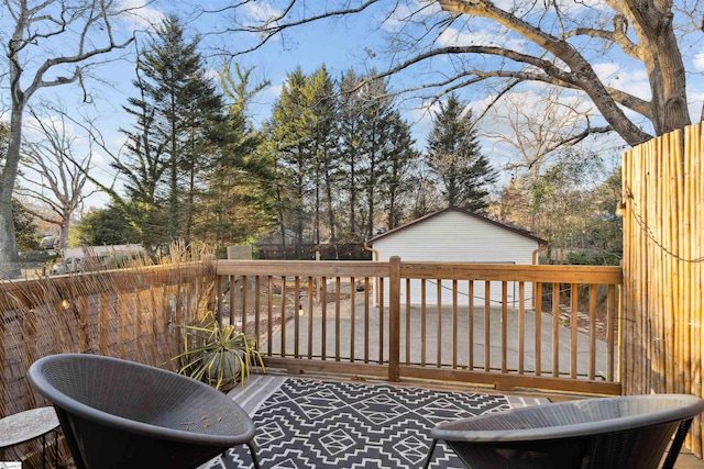 wooden terrace featuring a fenced backyard