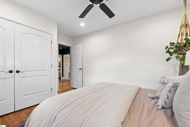 bedroom with a closet, a ceiling fan, wood finished floors, and recessed lighting