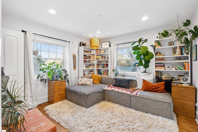 sitting room with light wood finished floors and recessed lighting