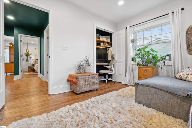 interior space featuring recessed lighting, light wood-style flooring, and baseboards