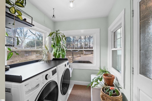 laundry room featuring washer and dryer, laundry area, and baseboards