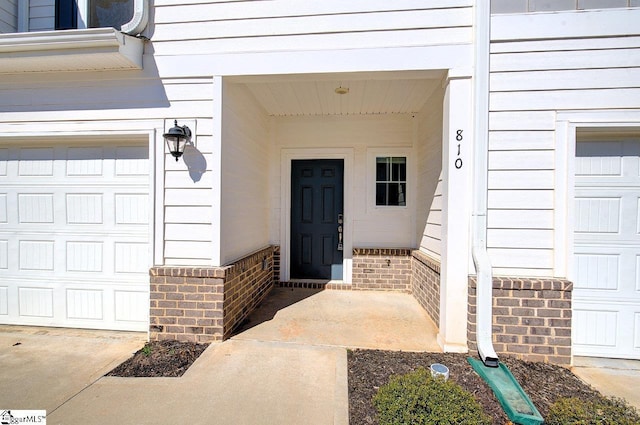 property entrance with brick siding