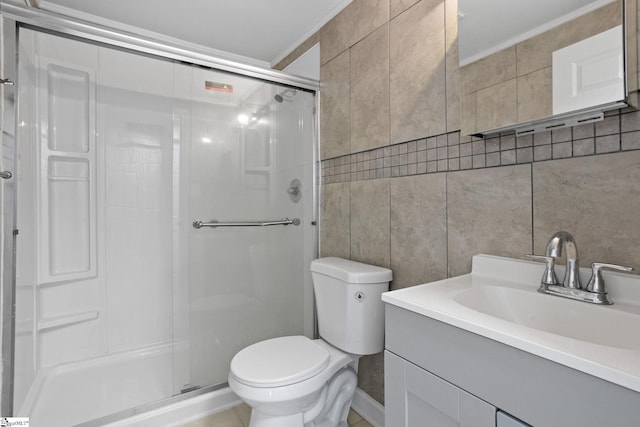 full bathroom featuring toilet, a stall shower, vanity, and tile walls