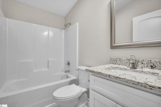 bathroom with vanity, toilet, and bathing tub / shower combination