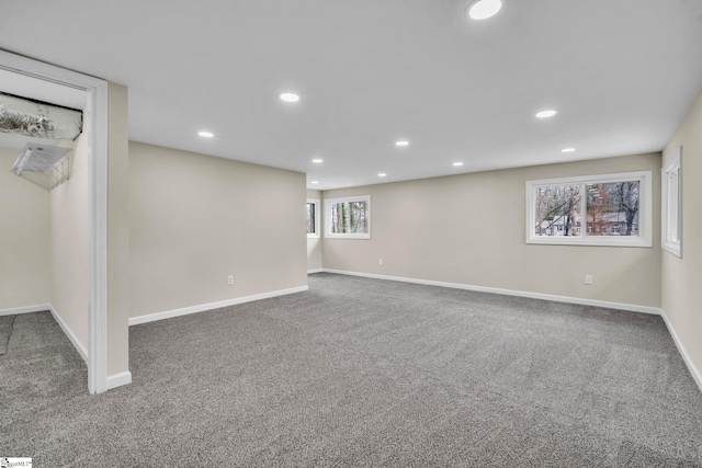 below grade area featuring recessed lighting, carpet flooring, and baseboards